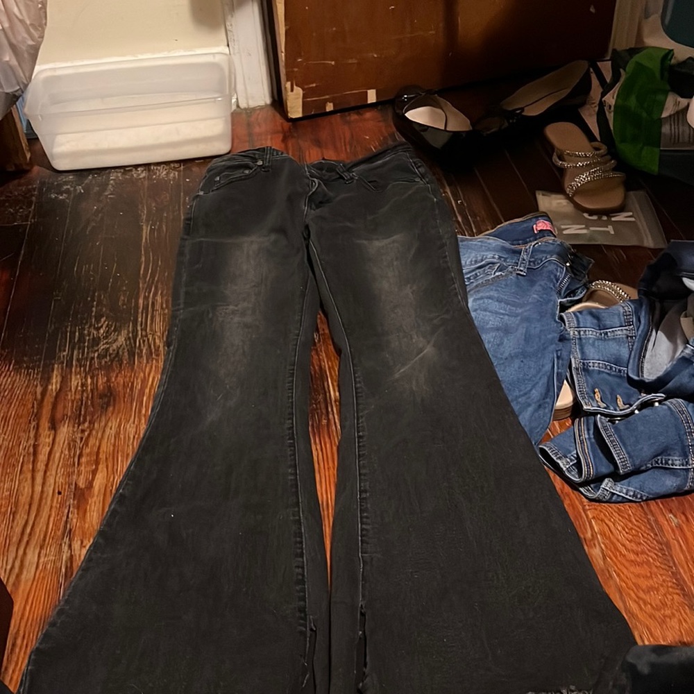 Black jeans with slits at the bottom